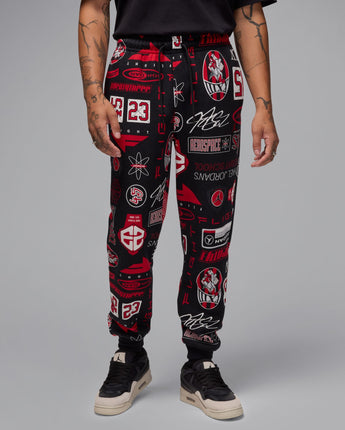 JORDAN ESSENTIAL AOP FLEECE PANTS | HM7257-010 BLACK/VARSITY RED